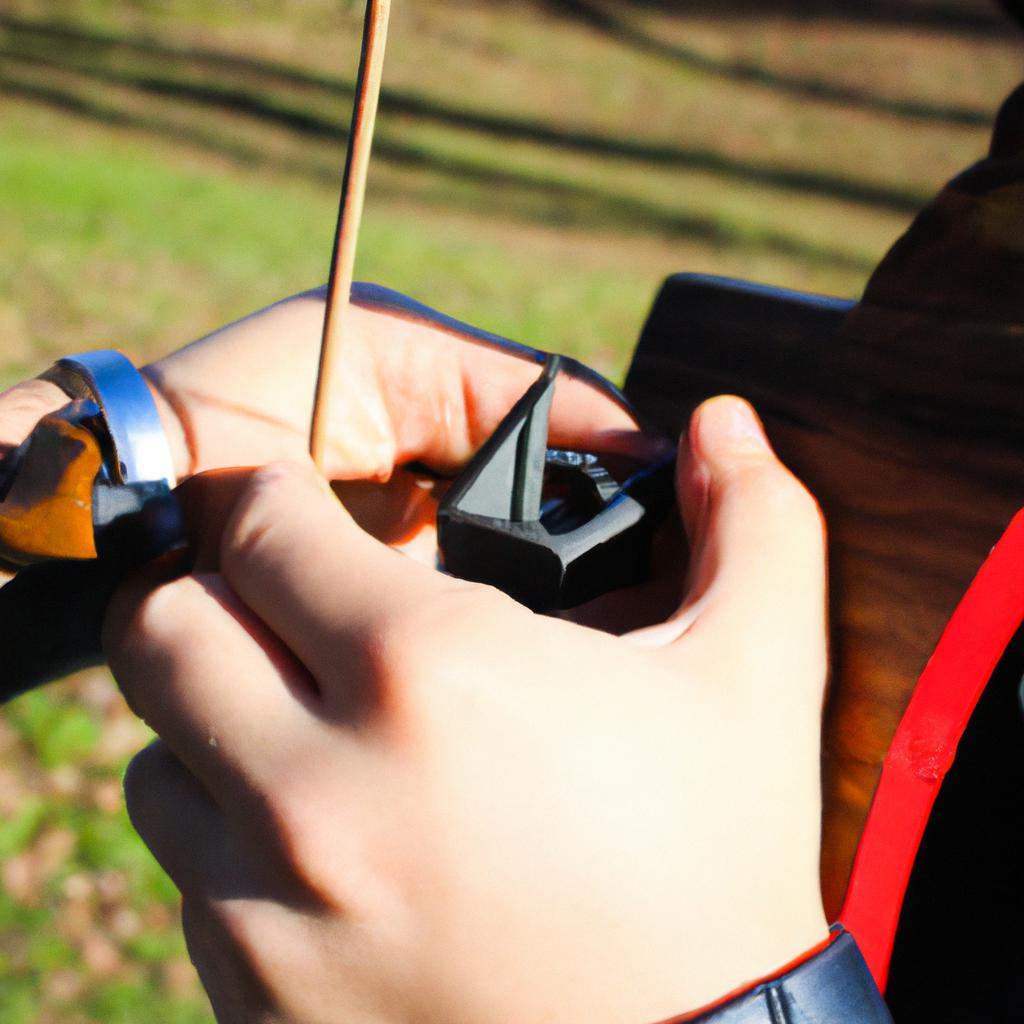 Person adjusting archery sight pin